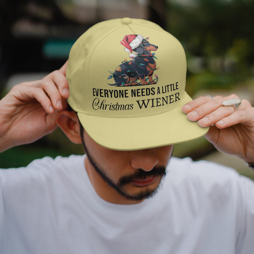 Festive dachshund with holiday lights and adult humor text.