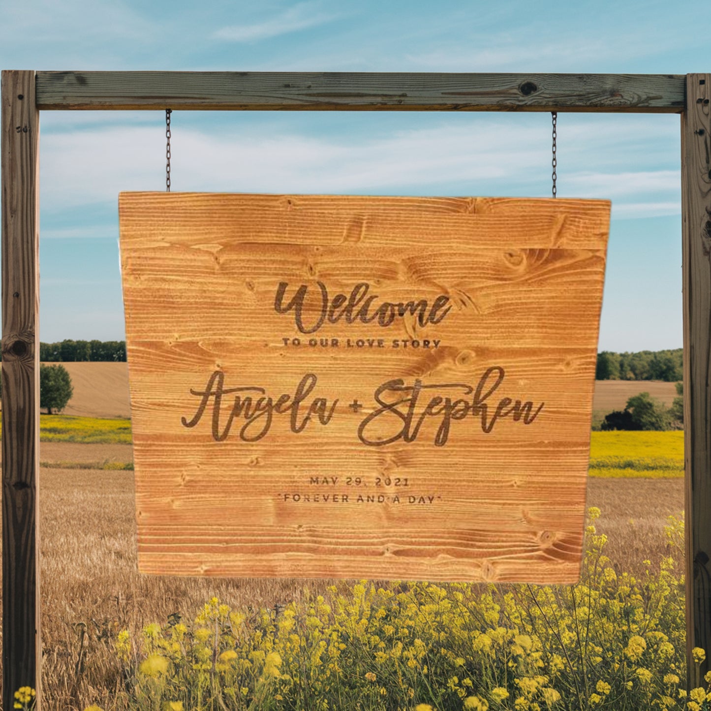 Hanging sign mockup with wooden frame and chains in a golden field