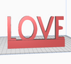 "3D printable word LOVE with stand STL file for romantic home decor."