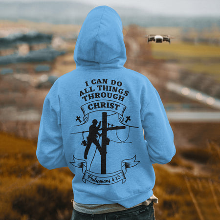 "Lineman Working on Electricity Pole with Christian Message"