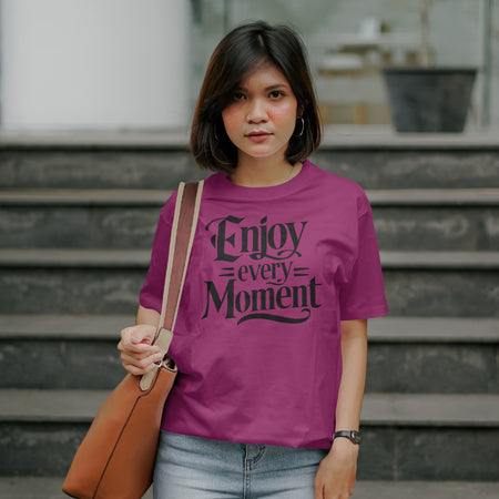 "Vintage-inspired calligraphy of 'Enjoy Every Moment' in black and white for sophisticated decor."