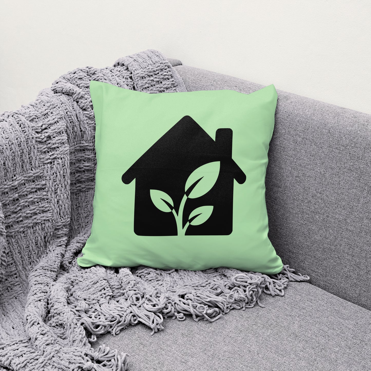 Black eco-friendly house graphic with three-leaf plant