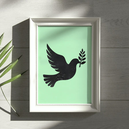 "Black dove silhouette with olive branch against a white background for spiritual decor."