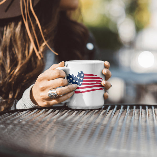 "Creative American flag design with stars in heart shape and artistic stripes."