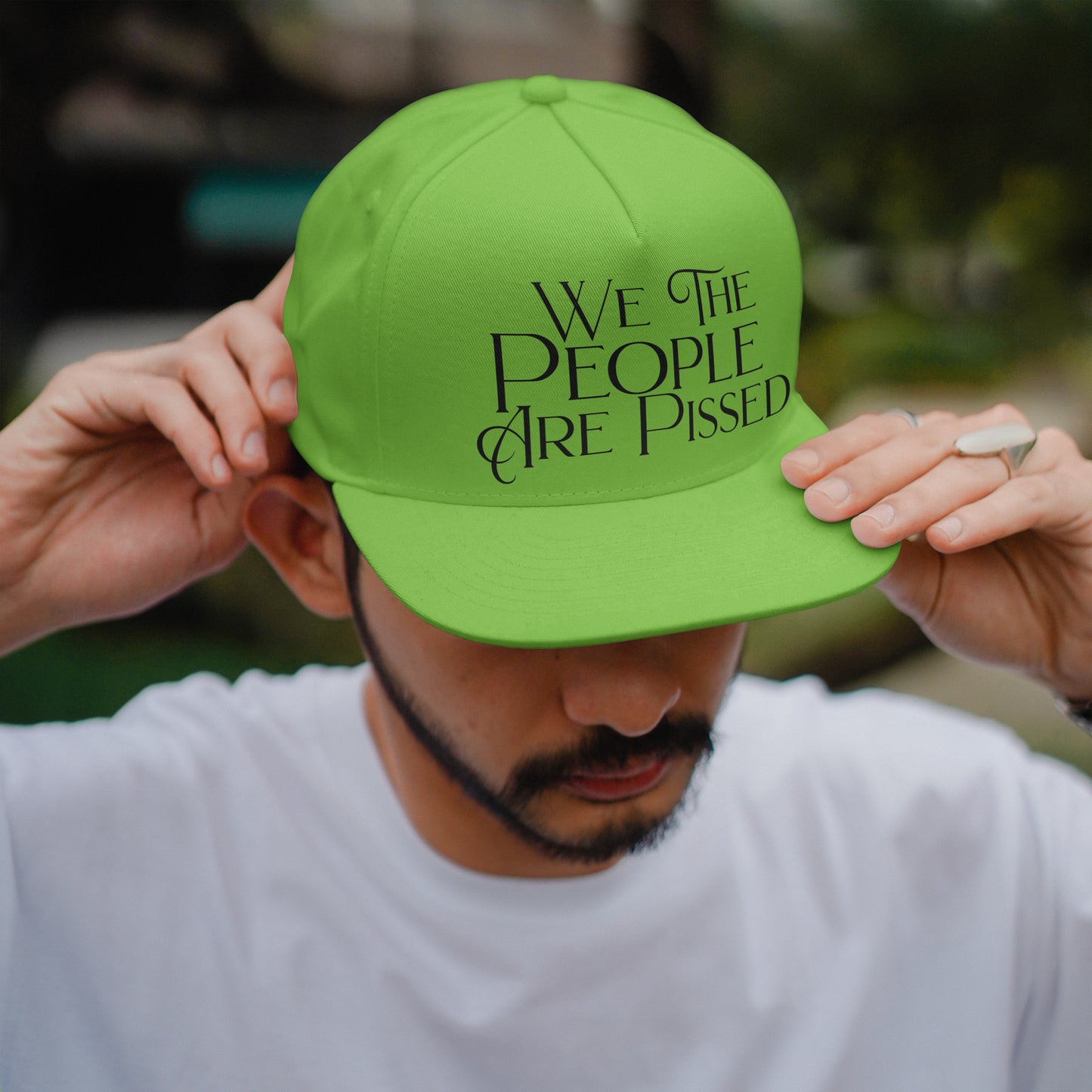 Black text design saying We the People Are Pissed