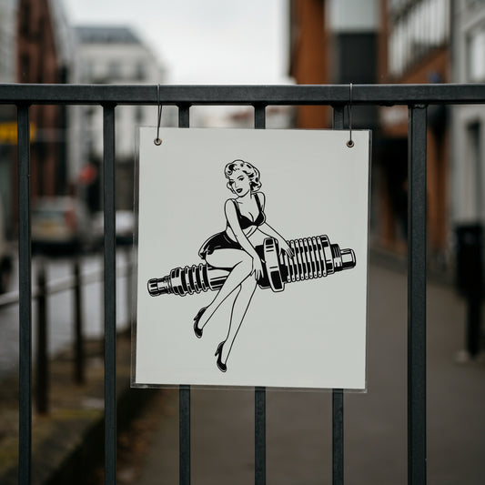 Poster of a stylized illustration of a woman sitting on a sparkplug against a blurred city street background.