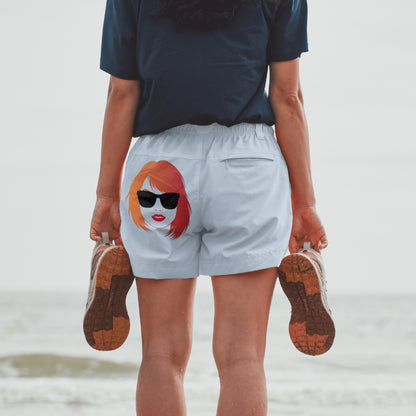 Taylor Swift PNG with vibrant red and orange hair and red lips
