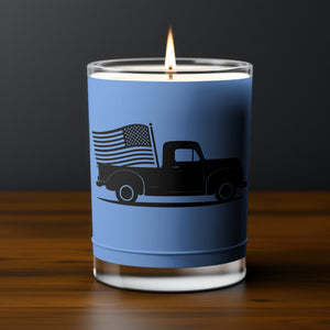 "Classic American truck in silhouette form, moving forward with a flag trailing."