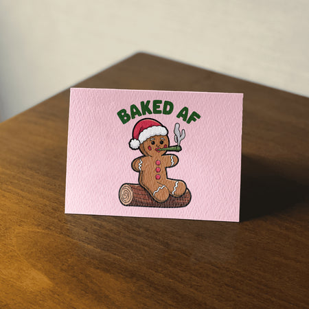 Marijuana clipart featuring gingerbread man with a joint and Santa hat
