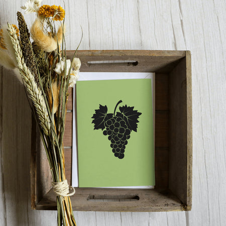 "Elegant all-black grape vine illustration for winery branding and decor."