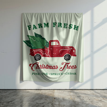 Vintage farm truck carrying Christmas trees graphic.
