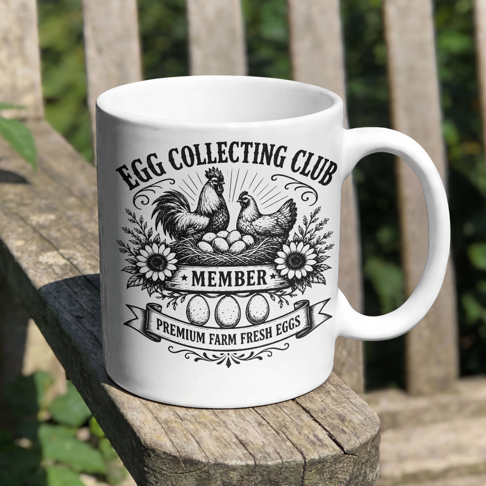 White mug with 'Egg Collecting Club' design on a wooden surface outdoors