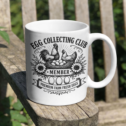 White mug with 'Egg Collecting Club' design on a wooden surface outdoors