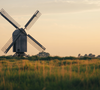 Rural Windmill Over Farm Field – 6s Golden Hour Stock Video