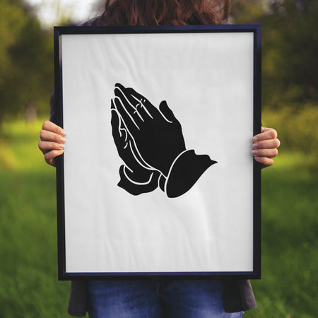 "Detailed black silhouette of clasped hands for spiritual designs."