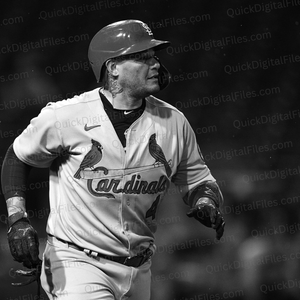 Close-up action shot of Yadi Molina in black and white.