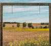 Rustic hanging mockup with clear blue sky and yellow flowers
