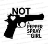 "Black silhouette of a handgun with 'NOT A PEPPER SPRAY KINDA GIRL' text."