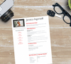 "Editable professional résumé template with photo slot on Canva."