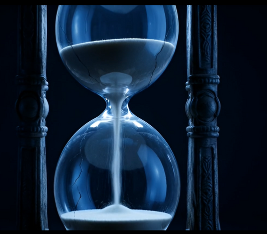 broken hourglass sand flowing fast
