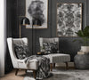 Monochrome Serenity print in a modern grey living room setting.